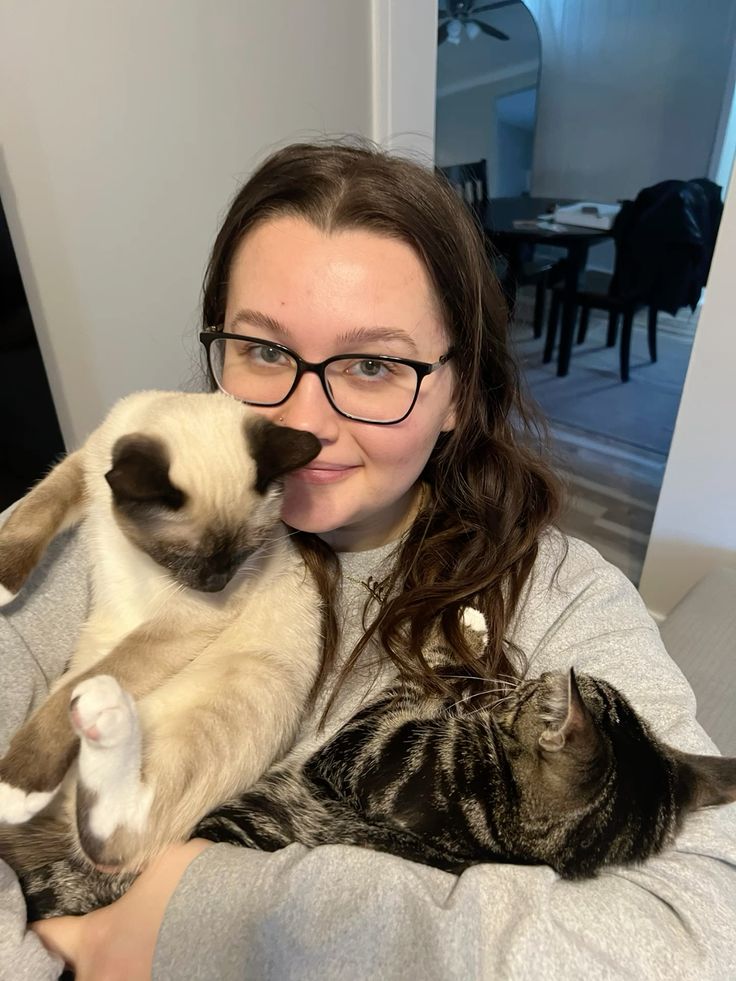 files/Holding_two_cats_in_arms_two_kittens.jpg